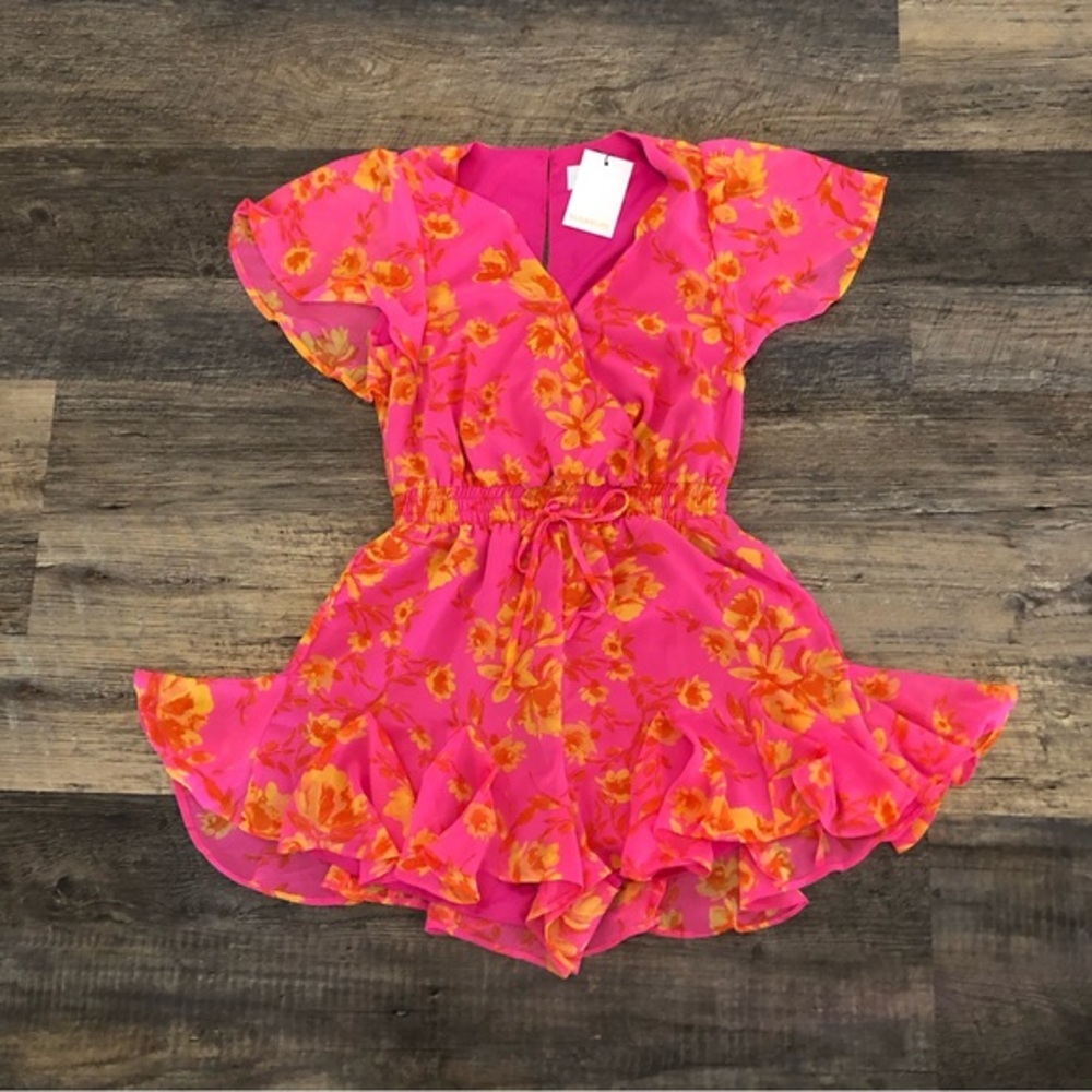 Sugarlips romper size XS.  Brand new with tags.  This Romper is gorgeous.